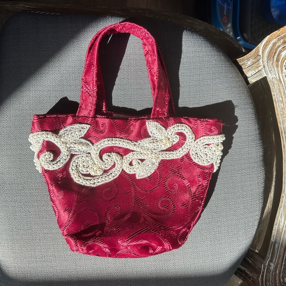 Vintage pearl embellished red bucket bag